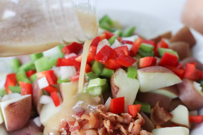 This flavorful Italian Potato salad is always a staple at any summer gathering I host. It's perfect for summer parties, potlucks or just as a simple side dish.....and it has bacon in it! Enough said!
