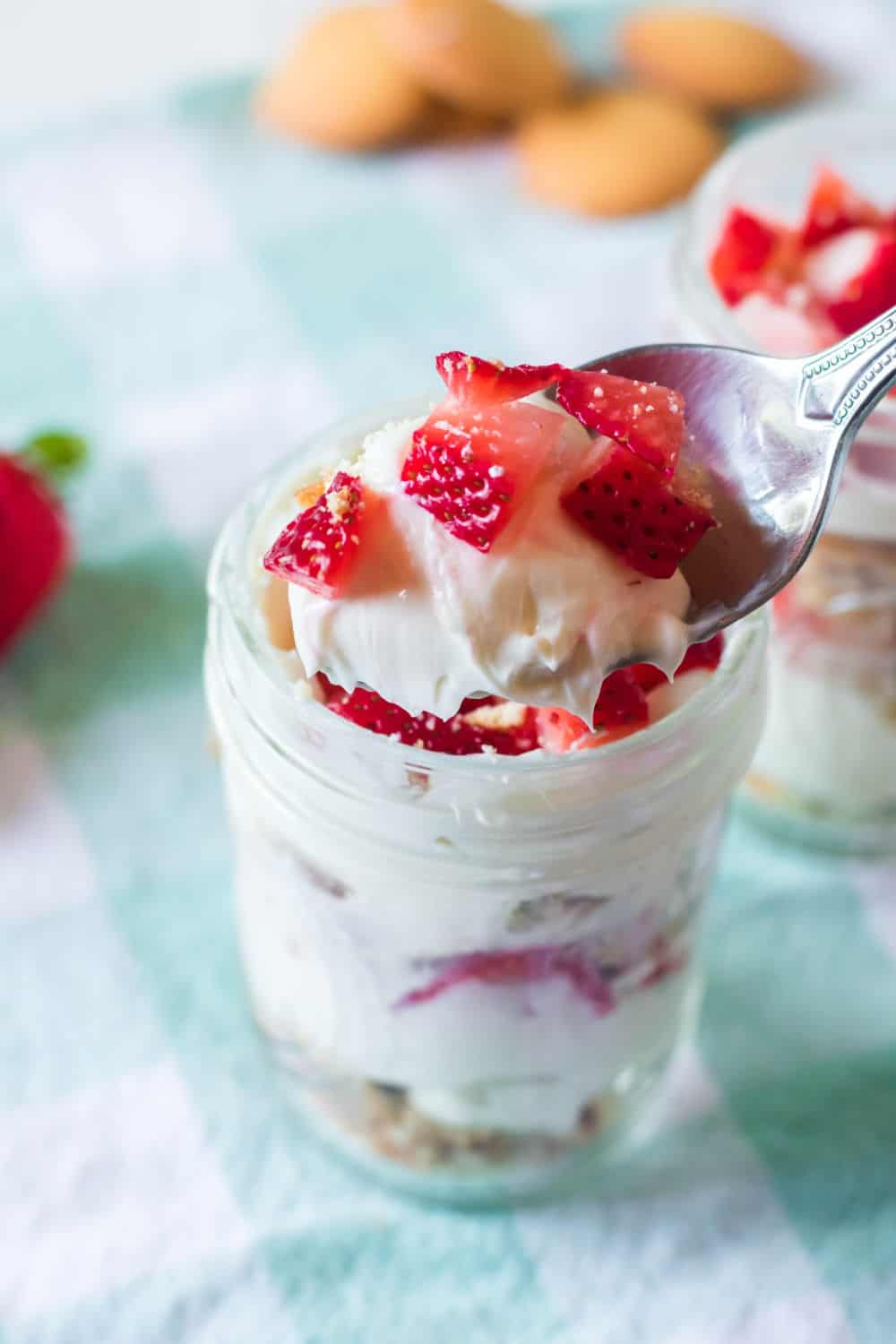 Raise your hand if you love no bake desserts? These No-Bake Strawberry Cheesecake Parfaits are an easy dessert recipe the whole family will love. #strawberryrecipe #strawberries #nobakedessert