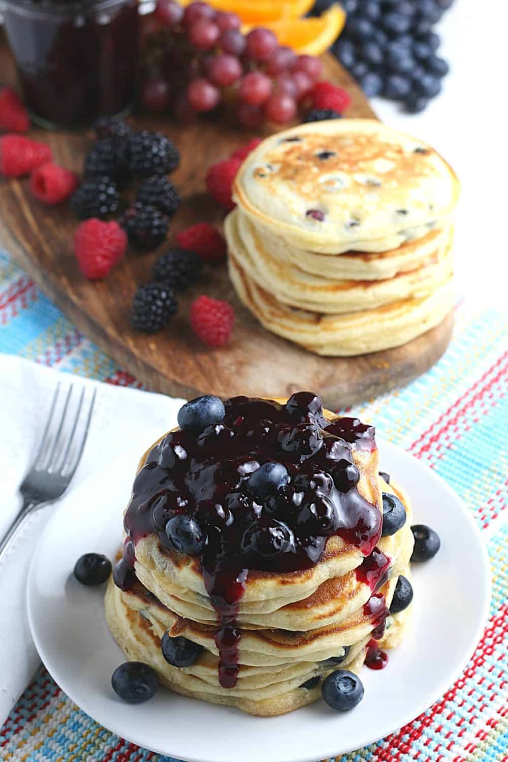 Start your morning off with a delicious batch of Blueberry Buttermilk Pancakes from scratch. This light and fluffy blueberry pancake recipe is perfect for blueberry season or all year round.