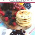 Start your morning off with a delicious batch of Blueberry Buttermilk Pancakes from scratch. This light and fluffy blueberry pancake recipe is perfect for blueberry season or all year round. Top this easy blueberry pancake recipe with homemade blueberry sauce for some extra blueberry flavor. Your family will love this easy buttermilk pancake recipe from scratch.