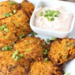 Baked sweet potato fritters are a delicious and healthy recipe. This dish is a perfect side dish or appetizer. This sweet potato fritter recipe is perfect to make in the fall or any time fo the year. #fritters #sweetpotatoes
