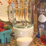 Cheers to Strawberry season. With just a few simple ingredients, you can make your own Strawberry Shortcake Daiquiris at home. Skip the mix and make fresh strawberry daiquiris at home using this easy recipe. It's the perfect slushy cocktail for cooling down in warmer weather! #strawberrydaiquiri #cocktails #slush