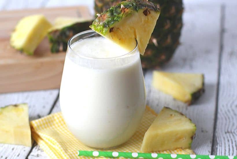 This Dole Whip Smoothie recipe is inspired by my favorite Walt Disney World Treat. This easy smoothie recipe is full of pineapple flavor and is perfect for breakfast, lunch or a snack. This Dole Whip recipe is the next best thing to visiting Disney World. #dolewhiprecipe #disneyfood #disneysnack #disneyrecipe #breakfastsmoothie #dolewhip