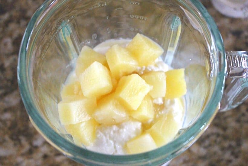 This Dole Whip Smoothie recipe is inspired by my favorite Walt Disney World Treat. This easy smoothie recipe is full of pineapple flavor and is perfect for breakfast, lunch or a snack. This Dole Whip recipe is the next best thing to visiting Disney World. #dolewhiprecipe #disneyfood #disneysnack #disneyrecipe #breakfastsmoothie #dolewhip
