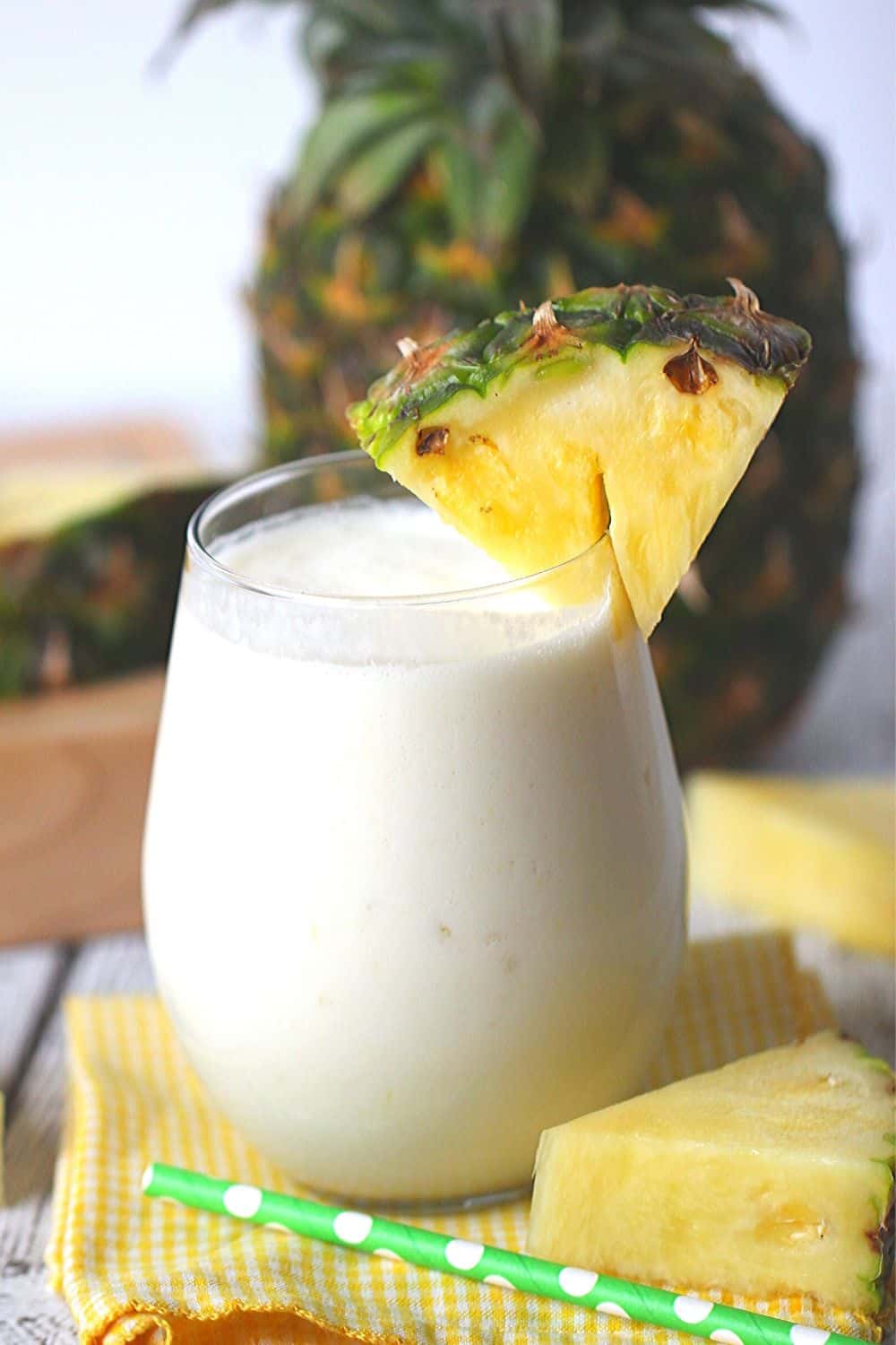 This Dole Whip Smoothie recipe is inspired by my favorite Walt Disney World Treat. This easy smoothie recipe is full of pineapple flavor and is perfect for breakfast, lunch or a snack. This Dole Whip recipe is the next best thing to visiting Disney World. #dolewhiprecipe #disneyfood #disneysnack #disneyrecipe #breakfastsmoothie #dolewhip