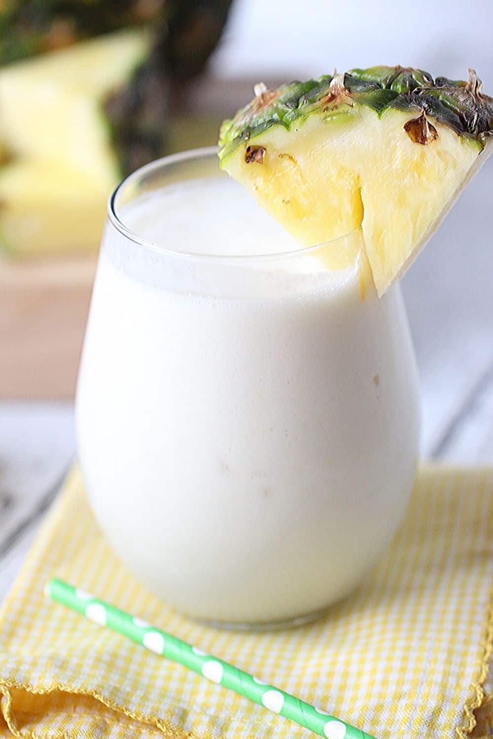 This Dole Whip Smoothie recipe is inspired by my favorite Walt Disney World Treat. This easy smoothie recipe is full of pineapple flavor and is perfect for breakfast, lunch or a snack. This Dole Whip recipe is the next best thing to visiting Disney World. #dolewhiprecipe #disneyfood #disneysnack #disneyrecipe #breakfastsmoothie #dolewhip