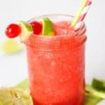 This Cherry Limeade Slush is a copycat recipe of your favorite Sonic Drive-In Drink. This easy drink recipe has the perfect balance of cherry and lime flavor. It is a perfect way to cool down and relax on a hot summer's day. This easy summer drink is perfect to serve at a summer party, potluck or bbq.