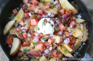 Loaded Skillet Potatoes make the perfect appetizer or side dish. Topped with lots of cheese and bacon, this recipe is a real winner! This easy potato recipe is a delicious take on the classic nacho recipe.