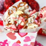 This easy Sweetheart Bark recipe is sure to capture the heart of your Valentine. You can't go wrong with a sweet snack filled with popcorn, pretzels and melted chocolate.