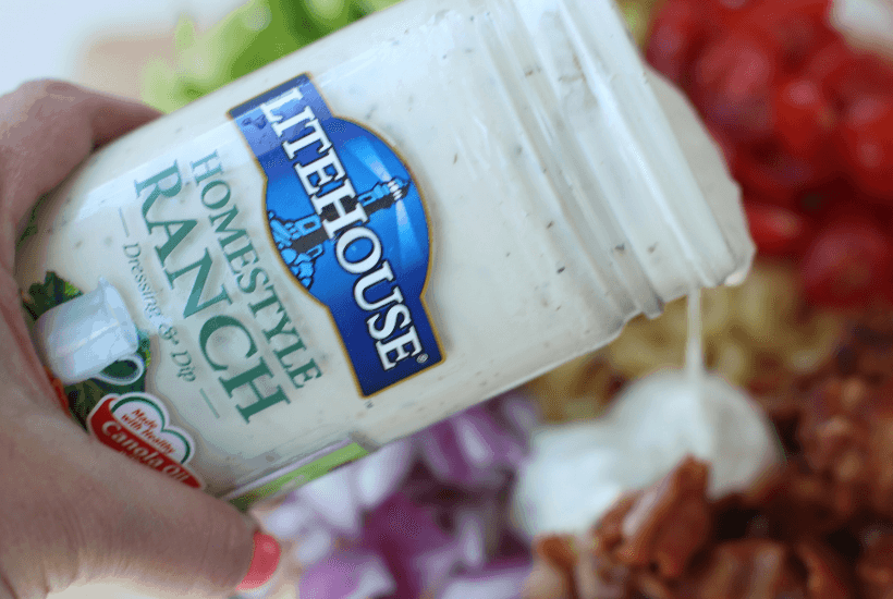 Everything is better with bacon! It's picnic season and this BLT Pasta Salad is the perfect summer salad recipe! This pasta salad recipe is filled with crispy bacon, fresh tomatoes and romaine. It is dressed with Litehouse Ranch Dressing. Save this kicked up macaroni salad recipe for your next backyard BBQ or picnic. #bltpastasalad #BLT #pastasalad #bacon #summersalad #macaronisalad