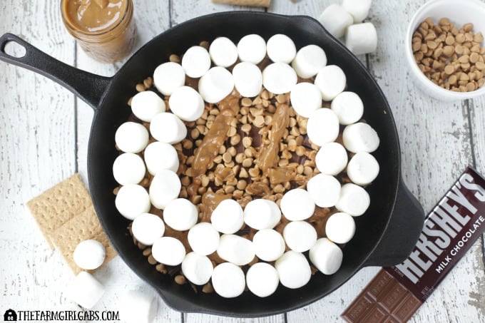 Chocolate Peanut Butter Skillet S'mores are an updated twist of the campfire classic. This recipe has the perfect amount of chocolate and peanut butter.