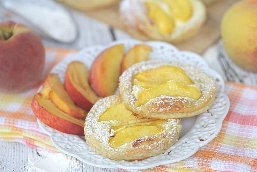 Nothing can go wrong on a day that starts out with these Peach Breakfast Danish made with puff pastry, fresh peaches and a sweet cheese filling. You will love this award-winning peach recipe. This easy breakfast danish is perfect to make when peaches are in season. This recipe can be served as a delicious peach dessert recipe or breakfast recipe.