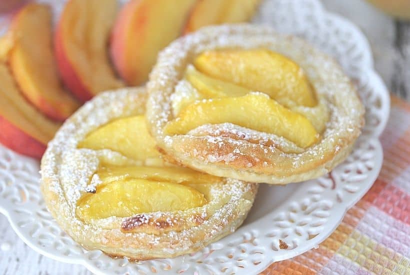 Nothing can go wrong on a day that starts out with these Peach Breakfast Danish made with puff pastry, fresh peaches and a sweet cheese filling. You will love this award-winning peach recipe. This easy breakfast danish is perfect to make when peaches are in season. This recipe can be served as a delicious peach dessert recipe or breakfast recipe.