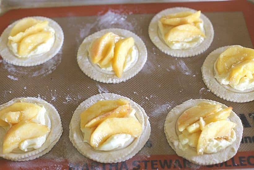 Nothing can go wrong on a day that starts out with these Peach Breakfast Danish made with puff pastry, fresh peaches and a sweet cheese filling. You will love this award-winning peach recipe. This easy breakfast danish is perfect to make when peaches are in season. This recipe can be served as a delicious peach dessert recipe or breakfast recipe.