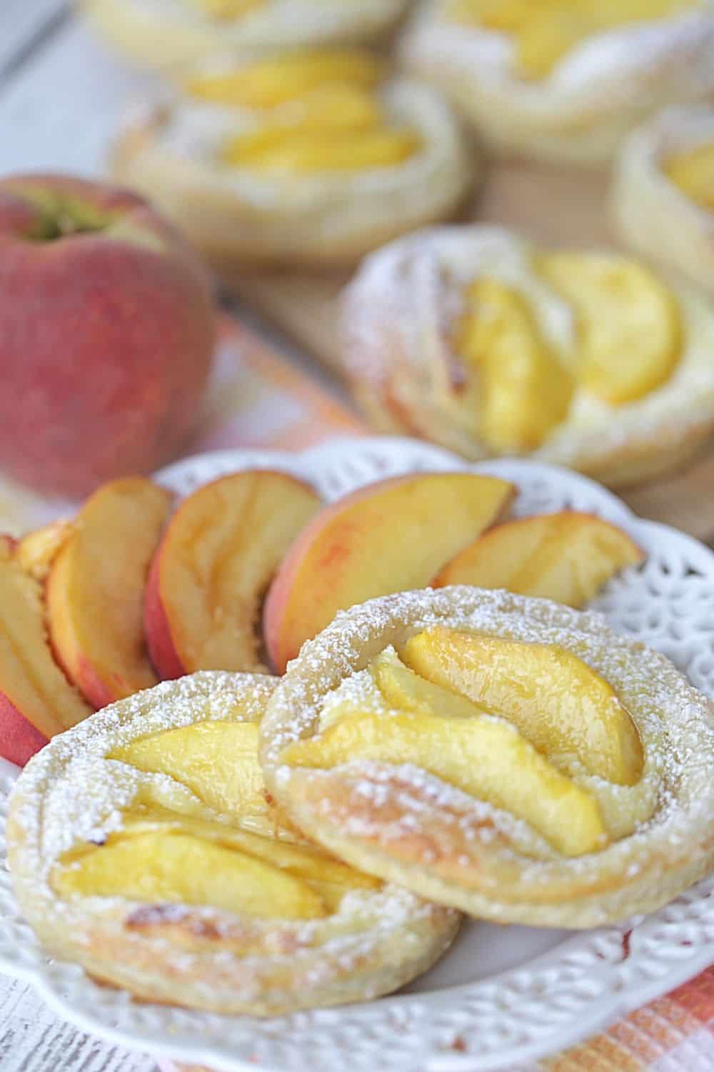 Nothing can go wrong on a day that starts out with these Peach Breakfast Danish made with puff pastry, fresh peaches and a sweet cheese filling. You will love this award-winning peach recipe. This easy breakfast danish is perfect to make when peaches are in season. This recipe can be served as a delicious peach dessert recipe or breakfast recipe.