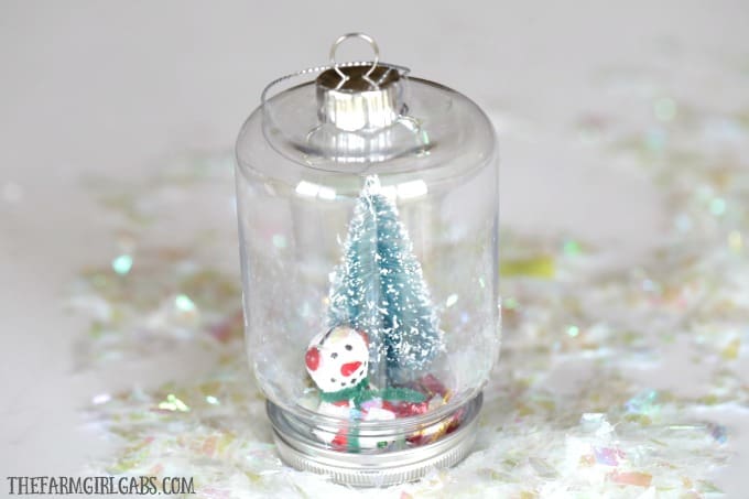 This DIY Snowman Snow Globe Ornament is an easy holiday craft to give along with your family Christmas card.