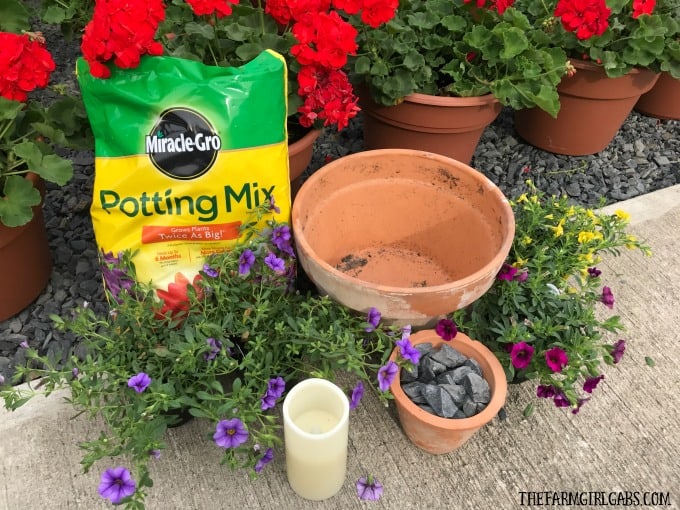 Beautify your backyard decor with this pretty Terra Cotta Candle Planter. This simple DIY candle planter will add some pretty ambiance to your patio.
