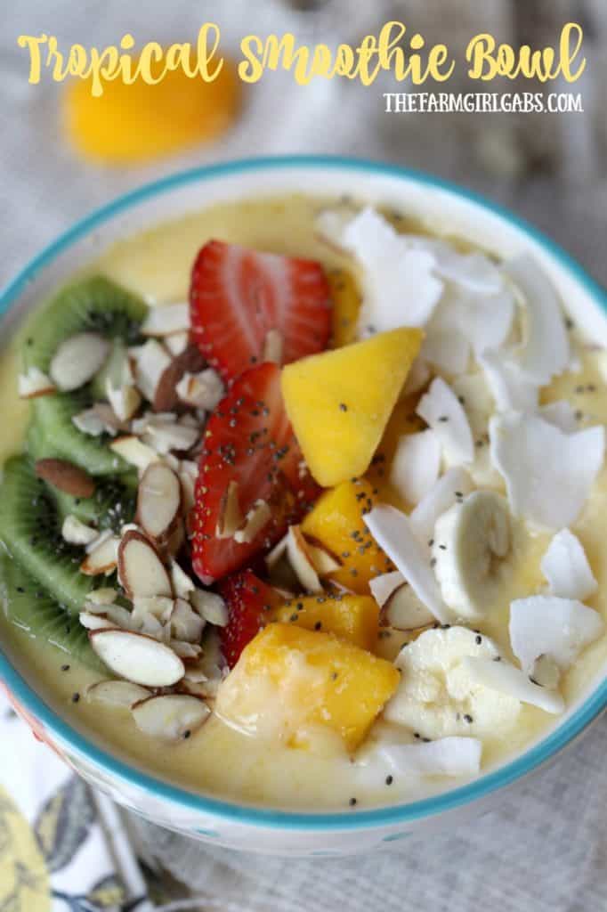This Tropical Smoothie Bowl is a blend of mango, tropical fruit and coconut milk - it's cool, refreshing and packed with flavor and nutrients. #Ad #FlavorAdventure