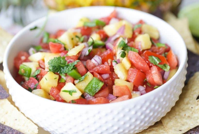 This Pineapple Pico de Gallo is the perfect way to add a sweet and zesty zip to your party. It's the perfect pico de gallo recipe to spice up your summer celebration. #picodegallo #pineapplesalsa #partyrecipe