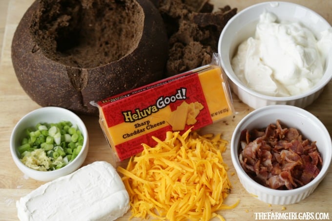 Looking for the perfect cheesy party dip? Well, look no further. This Bacon Cheddar Bread Bowl Dip is the perfect way to get the party started.