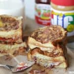 These Stuffed Peanut Butter And Jelly French Toast Sandwiches are a fun twist on the classic lunchbox favorite!