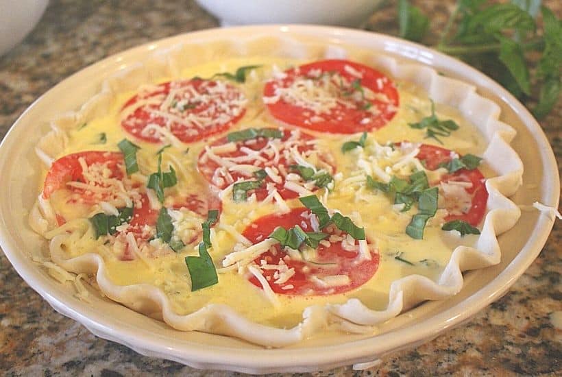 Tomato lovers rejoice! This easy Summer Tomato Pie recipe (or tomato quiche) is perfect for brunch, lunch or dinner. It's a great way to use all those ripe tomatoes from your garden or local farmers' market.