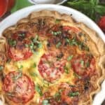 Tomato lovers rejoice! This easy Summer Tomato Pie recipe (or tomato quiche) is perfect for brunch, lunch or dinner. It's a great way to use all those ripe tomatoes from your garden or local farmers' market.