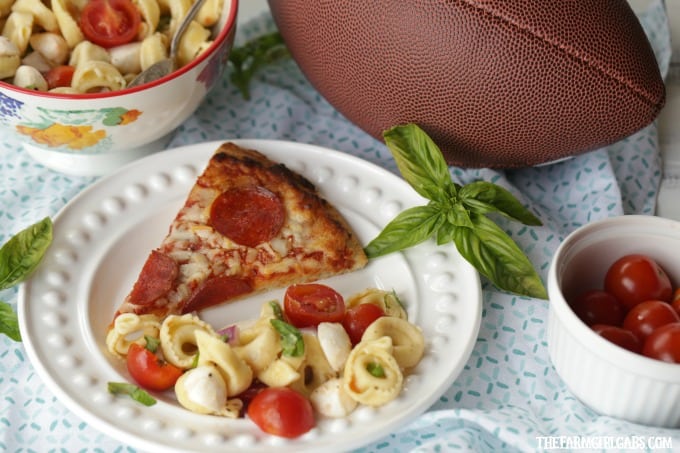 Turn pizza night into party night with this delicious Caprese Tortellini Salad. This recipe is the perfect quick side dish for a weeknight dinner or party.
