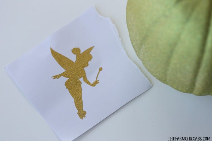 Celebrate Halloween with a little faith, trust, and this Tinker Bell Illuminated Pixie Dust Pumpkin. Create your own with this easy tutorial.