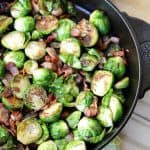 Pan Seared Brussels Sprouts With Bacon are a super quick side dish ready in 20 minutes flat! It's the perfect recipe to serve at Thanksgiving or for a weeknight meal. #SideDish #Recipe