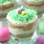 These colorful No Bake Coconut Cheesecake Parfaits are a sweet way to welcome spring. They are a perfect Easter dessert recipe for your holiday celebration. This no-bake dessert recipe can be served in mason jars or parfait dishes. This easy holiday dessert recipe can also be made ahead of time. #nobakedessert #masonjarrecipe #easterdessert #cuteeasterdessert