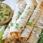 These Baked Buffalo Chicken Flautas as crispy, cheesy and full of buffalo chicken flavor. Feed a crowd this Cinco de Mayo with these delicious Baked Buffalo Chicken Flautas.