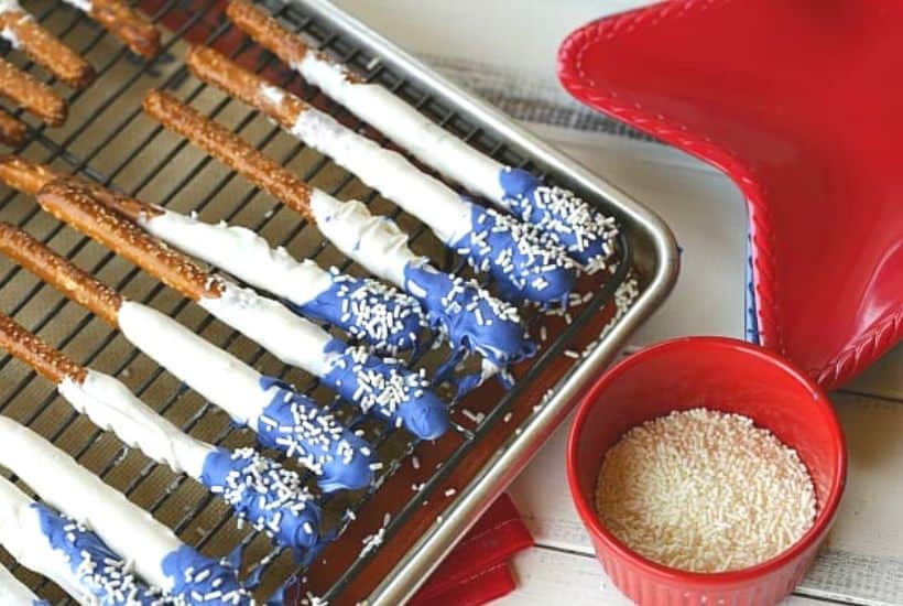 How about a fun patriotic recipe everyone will enjoy? These red, white and blue Stars And Stripes Dipped Pretzels will be a hit at your next patriotic celebration. This dipped pretzel recipe is easy to make and is perfect to serve at a party.