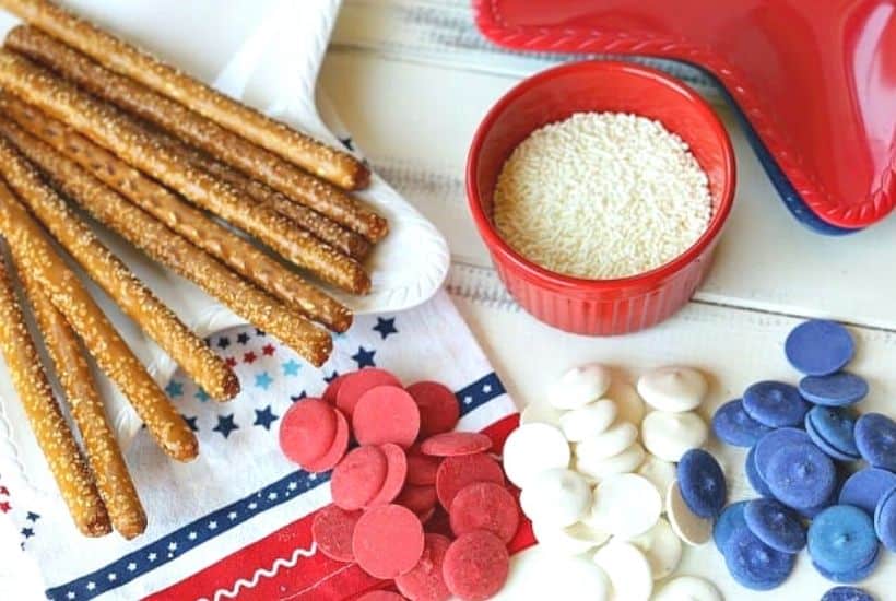How about a fun patriotic recipe everyone will enjoy? These red, white and blue Stars And Stripes Dipped Pretzels will be a hit at your next patriotic celebration. This dipped pretzel recipe is easy to make and is perfect to serve at a party.