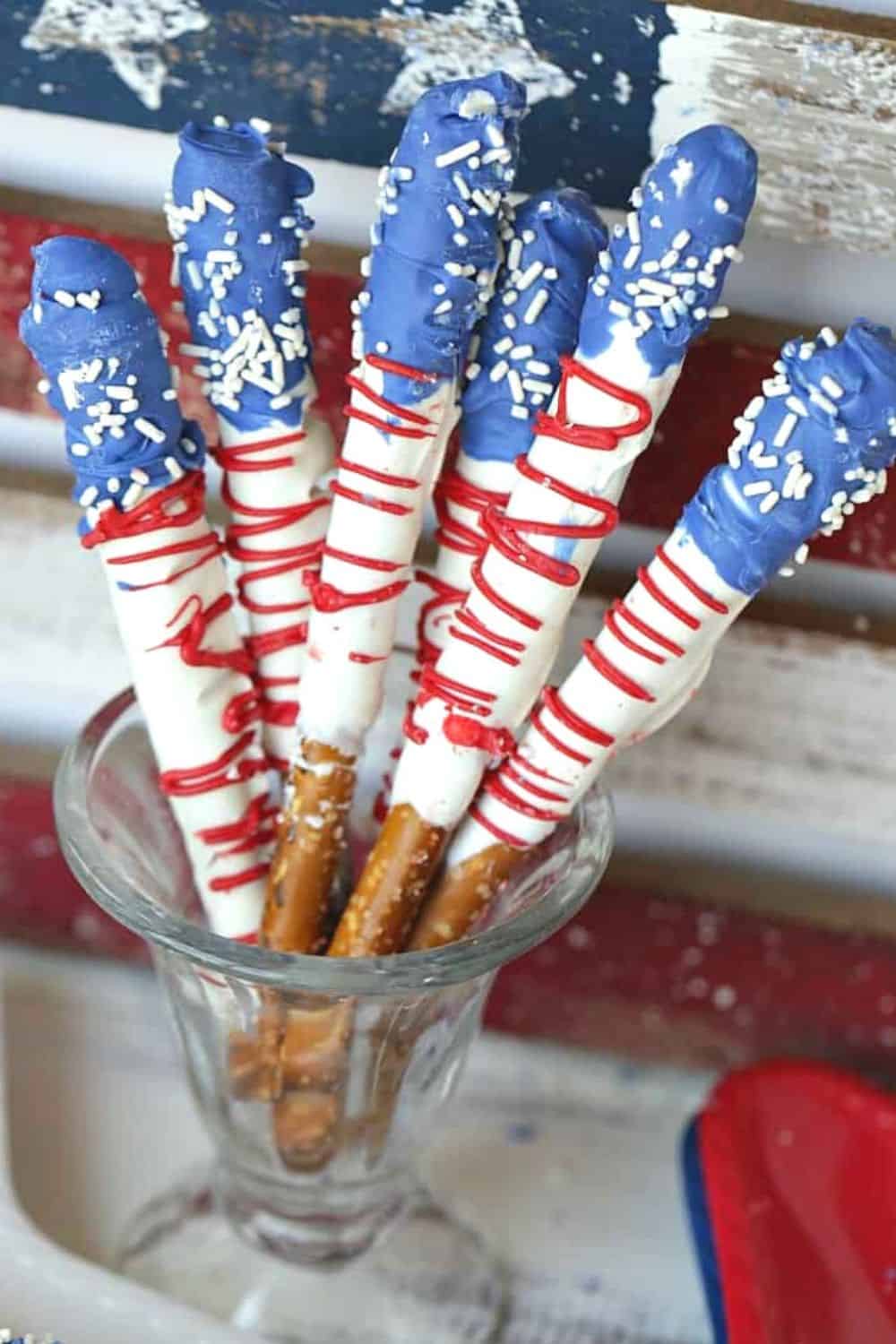 How about a fun patriotic recipe everyone will enjoy? These red, white and blue Stars And Stripes Dipped Pretzels will be a hit at your next patriotic celebration. This dipped pretzel recipe is easy to make and is perfect to serve at a party.
