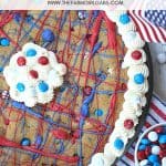 This festive Firecracker Cookie Cake recipe is the perfect dessert for your patriotic celebration! This easy chocolate chip cookie is decorated in red, white and blue and is a perfect recipe for the 4th of July, Memorial Day or Labor Day.