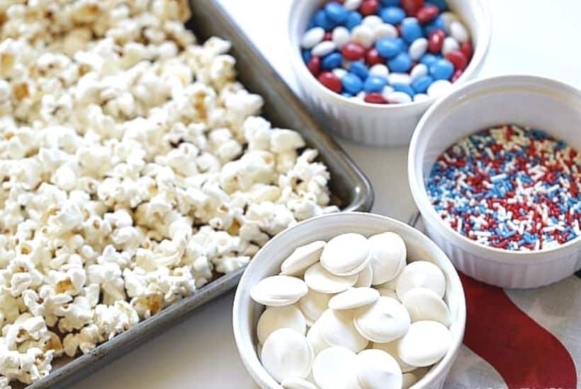 Salute the red, white and blue with this tasty Patriotic White Chocolate Popcorn. This easy popcorn recipe is perfect for a 4th of July Party or patriotic celebration.