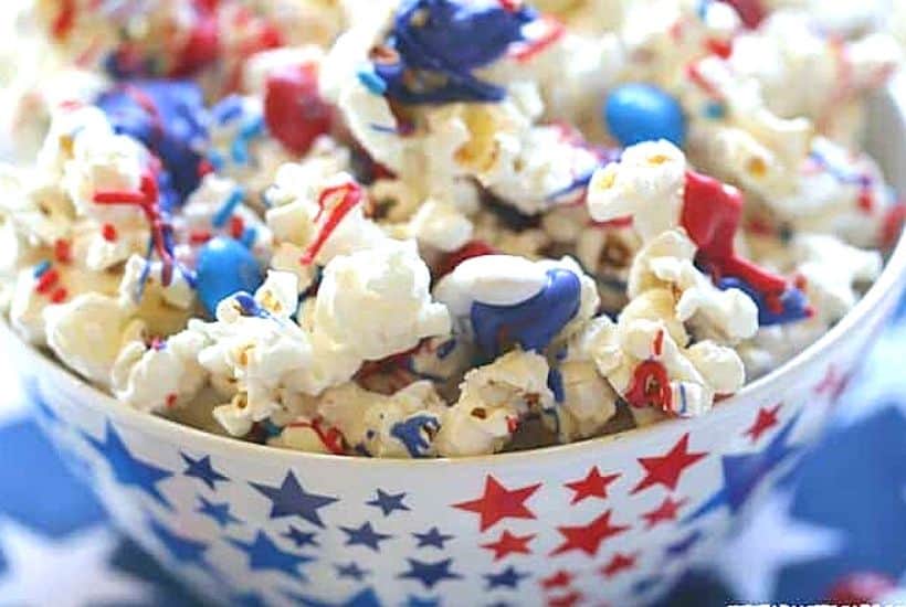 Salute the red, white and blue with this tasty Patriotic White Chocolate Popcorn. This easy popcorn recipe is perfect for a 4th of July Party or patriotic celebration.