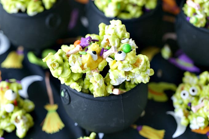 Double, double toil and trouble, Fire burn, and cauldron bubble. Stir up a batch of this ghoulish Cauldron Corn for some Halloween fun. #Halloween #Halloweenparty #HalloweenCandy #Snacks #Popcorn