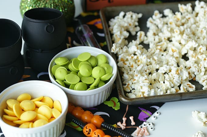 Double, double toil and trouble, Fire burn, and cauldron bubble. Stir up a batch of this ghoulish Cauldron Corn for some Halloween fun. #Halloween #Halloweenparty #HalloweenCandy #Snacks #Popcorn