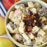 This Apple Cranberry Fruit Salad recipe is the perfect fall dessert. Apples, craisins and pecans pair up to create this delicious creamy fall fruit salad recipe. The salad is tossed in a simple cream cheese and yogurt dressing.