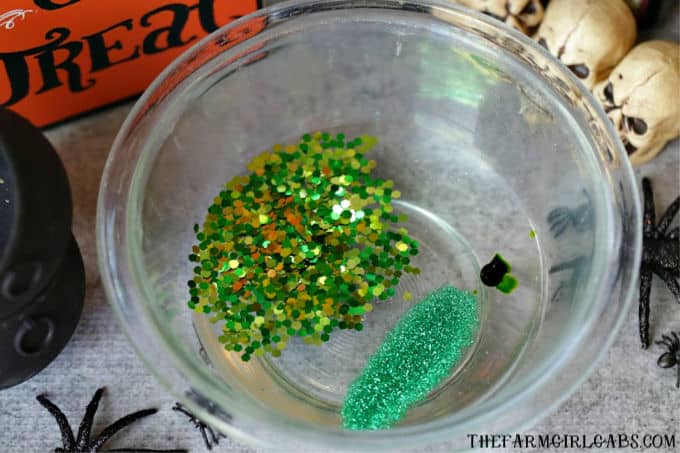 The Sanderson Sisters are at it again. A special mixture of Hocus Pocus, bat wings and bones makes up this spooky Halloween Cauldron Slime. #Slime #SlimeRecipe #Halloween #HalloweenCraft #KidsCraft
