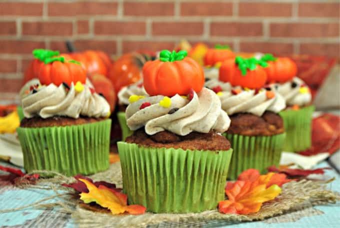 Pumpkin Spice Cupcakes are the perfect way to celebrate the fall season. They are full of pumpkin spice and topped with a sweet cinnamon buttercream frosting. #pumpkinspicecupcakes #pumpkinrecipe #fallbaking #pumpkindessert #cupcakes