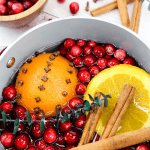 This holiday stovetop potpourri is the perfect blend to make for the holiday season. Make a batch and leave it simmering on your stove all day for an amazing holiday aroma. #Potpourri #StovetopPotpourri #Christmas #ChristmasDecoration #DIY #PotpourriRecipe #SimmeringPotpourri