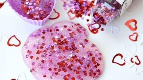 You and your kids will LOVE making this easy DIY Valentine's Day Slime project. This fun craft makes a great party favor too! #Slime #ValentinesDay #Crafts #DIY #Kids #KidsCrafts #PartyIdeas