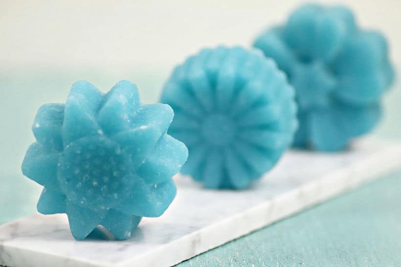 It's a self-care kind of day. Pamper yourself and whip up a batch of these DIY Flower Sugar Scrub Cubes made with Essential Oils. Keep them for yourself of give the gift of pampering. #essentialoils #sugarscrub #sugarscrubcubes