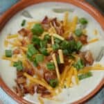 Creamy and comforting, you won't be able to resist this easy Loaded Baked Potato Soup recipe. Warm-up with a bowl of this delicious soup recipe that is full of potatoes, cheese and bacon. This is the best baked potato soup recipe. This soup recipe is the ultimate comfort food that is topped with your favorite baked potato toppings.