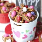 A little bit sweet, a little bit salty and oh so good! These Valentine ROLO Pretzel Sandwiches are a sweet treat for Valentine's Day. This recipe is an easy Valentine treat to make for class parties, family and friends. They are a huge hit for Valentine's Day. You can change the M&M colors and make these a for Christmas too. They are a huge holiday hit. #rolo #rolopretzels #valentinesdaycandy #valentinesdaytreats #christmastreats #christmascandy