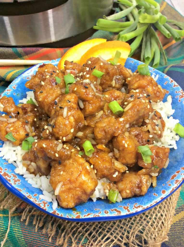 Ready in 20 minutes, this Instant Pot Orange Chicken recipe is a delicious option to ordering Chinese take-out. Raise your hand if you love Instant Pot recipes! #InstantPot #OrangeChicken #InstantPotRecipe #EasyMeal #ChineseFood