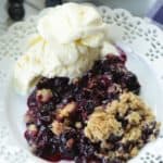 It's blueberry season! This easy blueberry crisp recipe it the perfect way to celebrate. This fruit crisp is super simple and perfect with a dollop of ice cream. #blueberrycrisp #blueberryrecipe #summerdessert